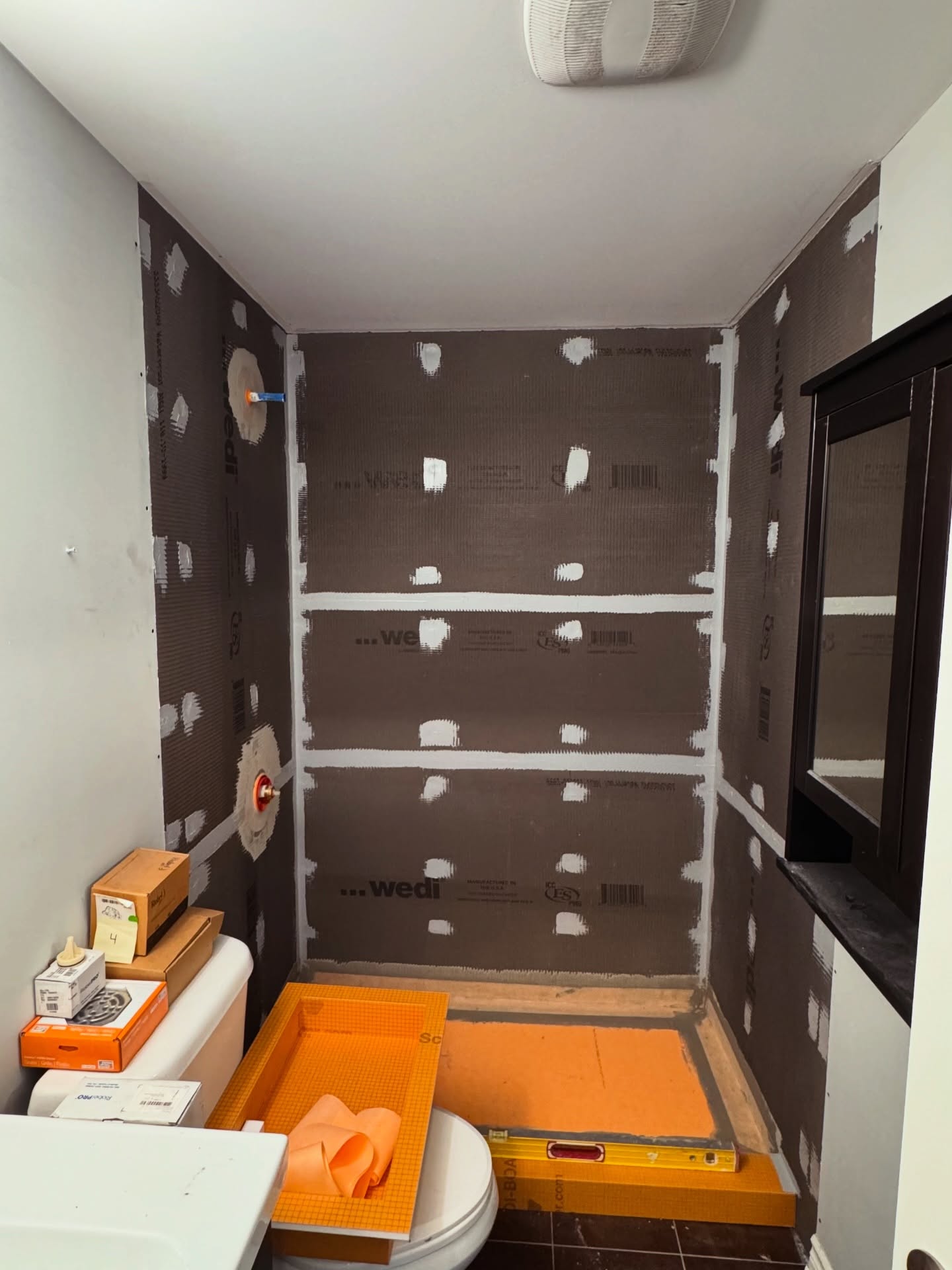 Bathroom remodel detail with custom tile work and modern design - Done Right Home Improvements